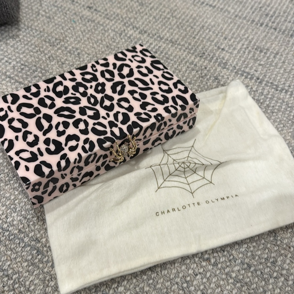 Charlotte Olympia pink acrylic spider clutch